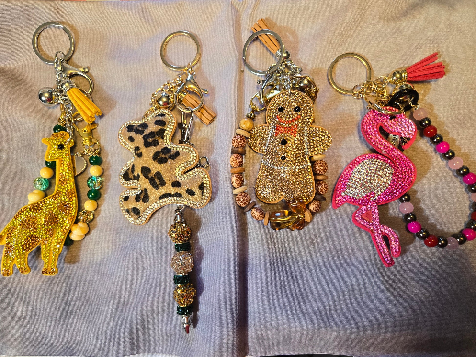 Four decorative keychains, Gingerbread man and various animals