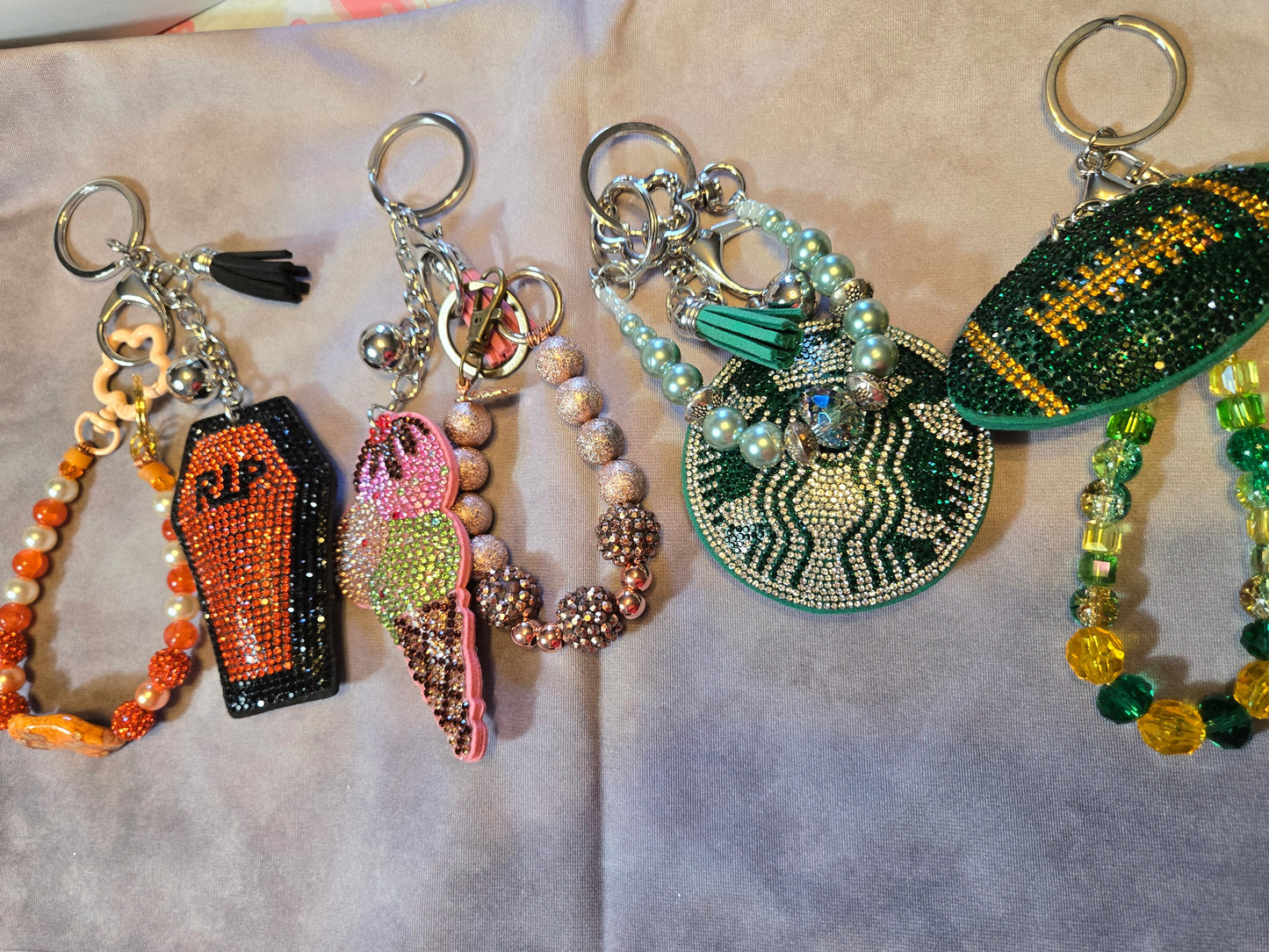Collection of colorful keychains with various designs 