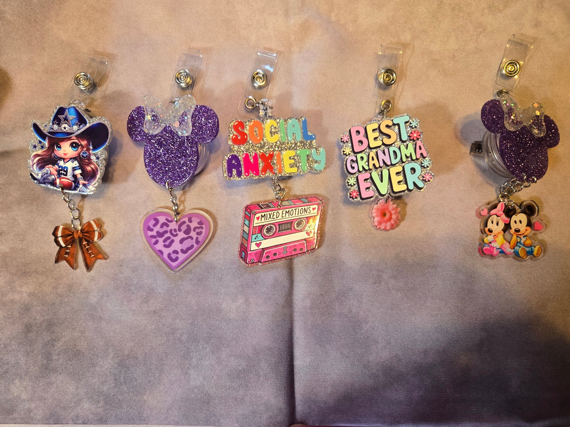 Collection of colorful badge holders with various designs 