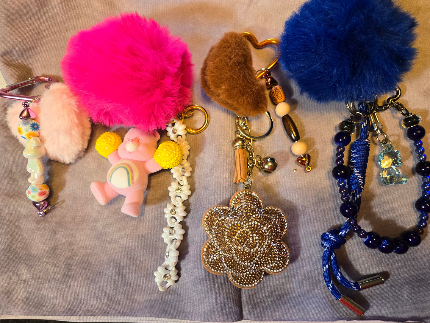 Collection of colorful keychains with pom-poms and beads 