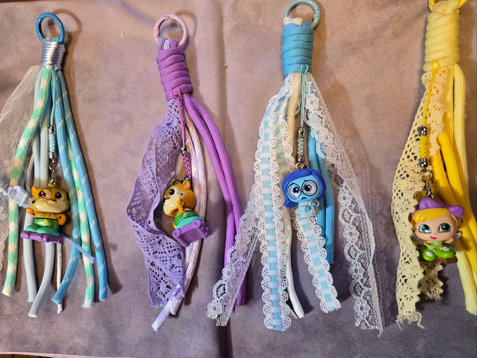 Collection of decorative keychains with character charms 