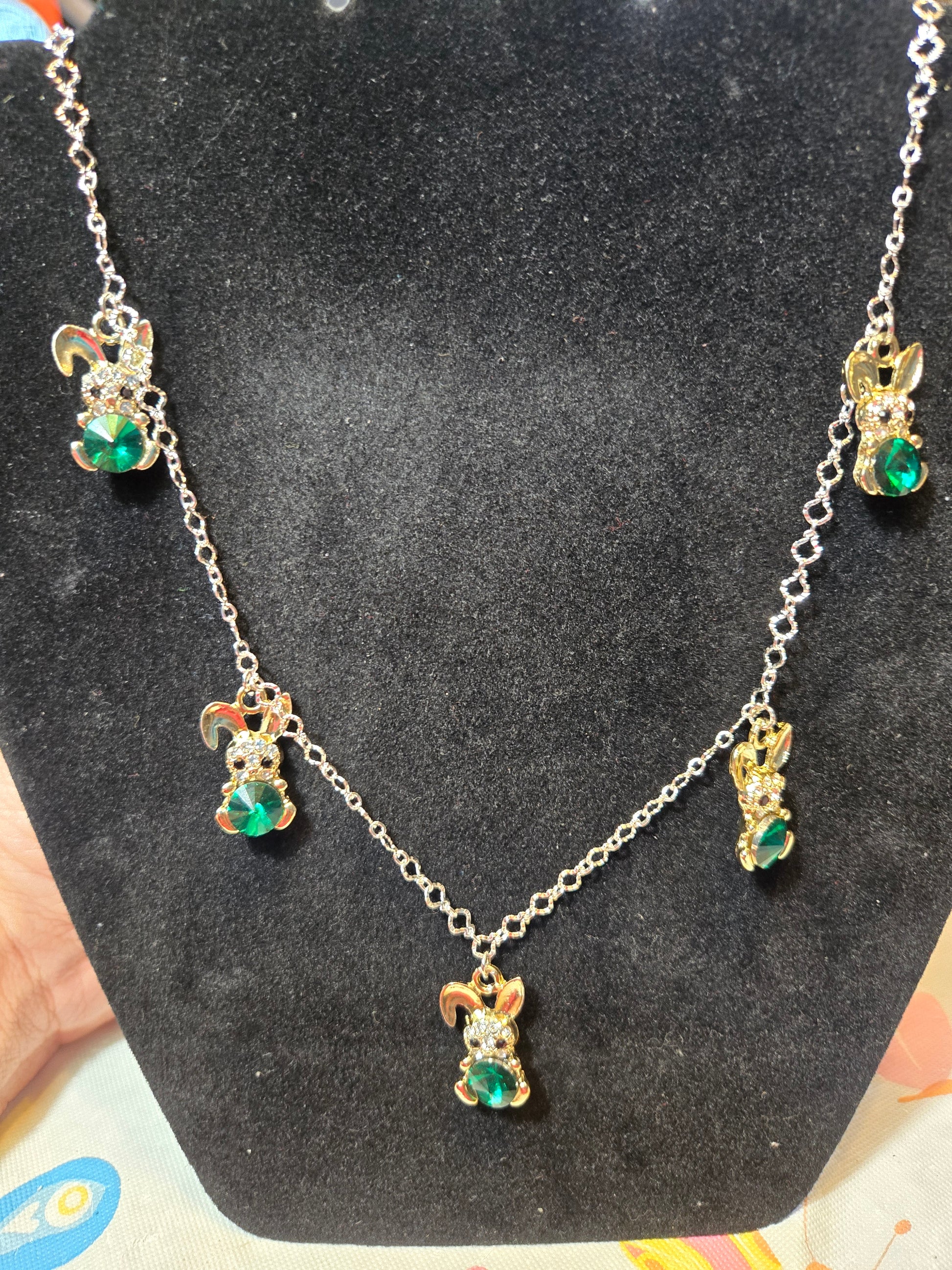 Delicate metal neckace with small green gemstone rabbit charms 