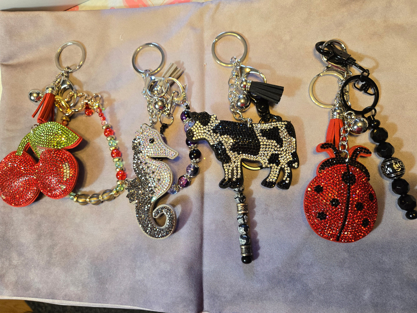 Four keychains with different designs o
