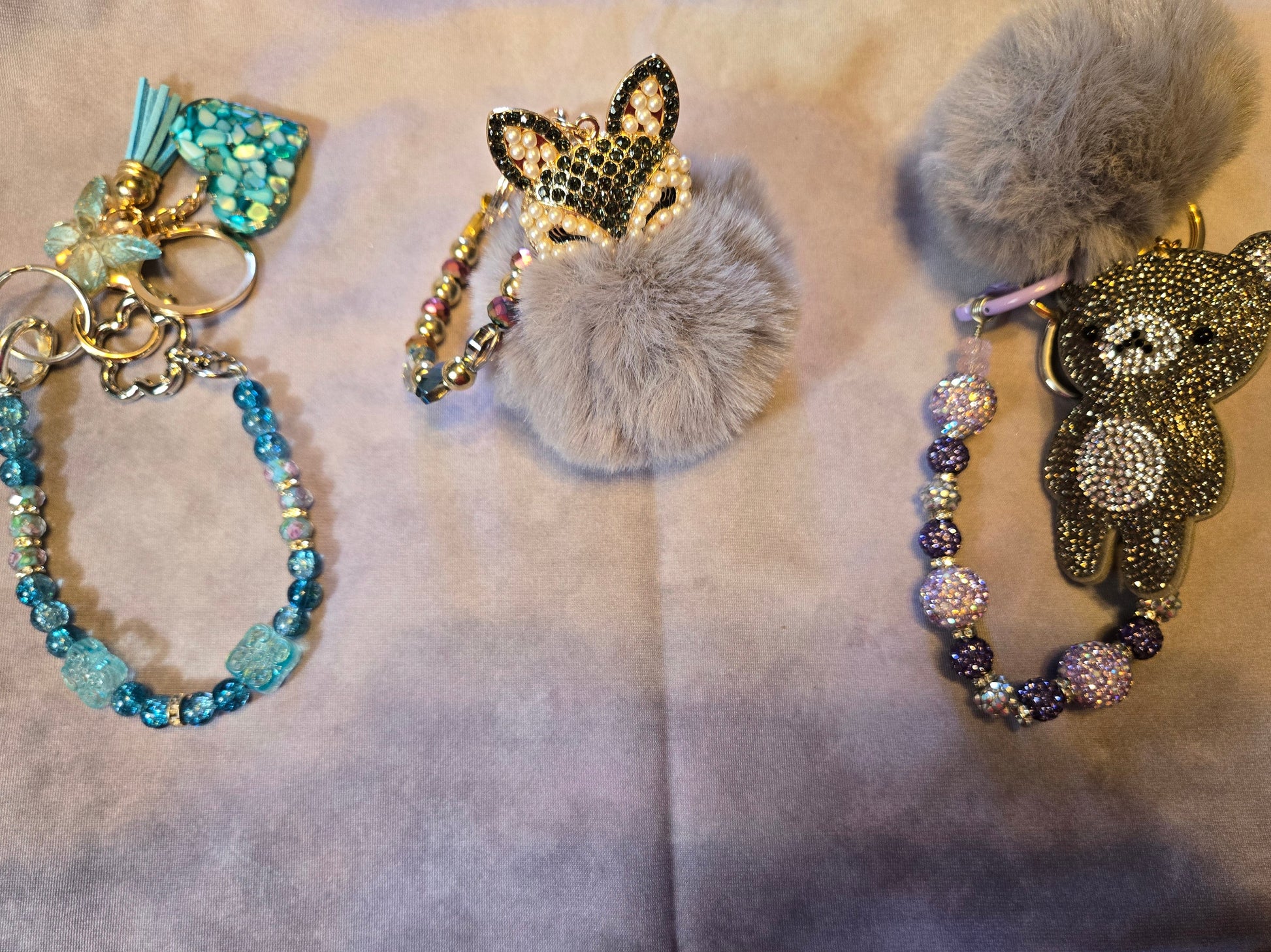 Two decorative keychains with beads and animal figures 