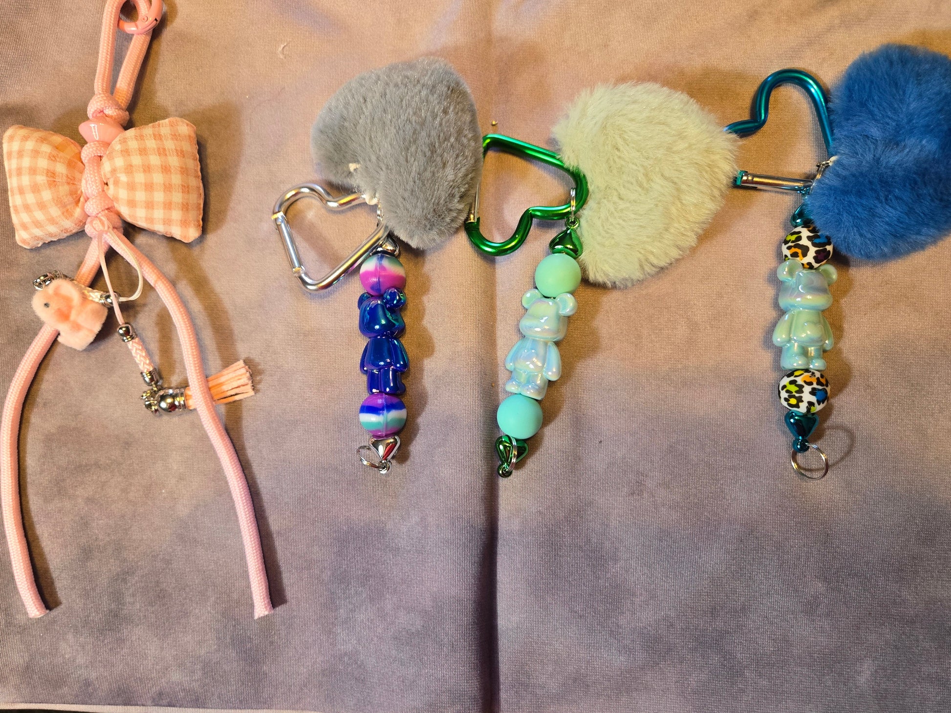 Keychains using heart shaped pom poms and and gingham bow