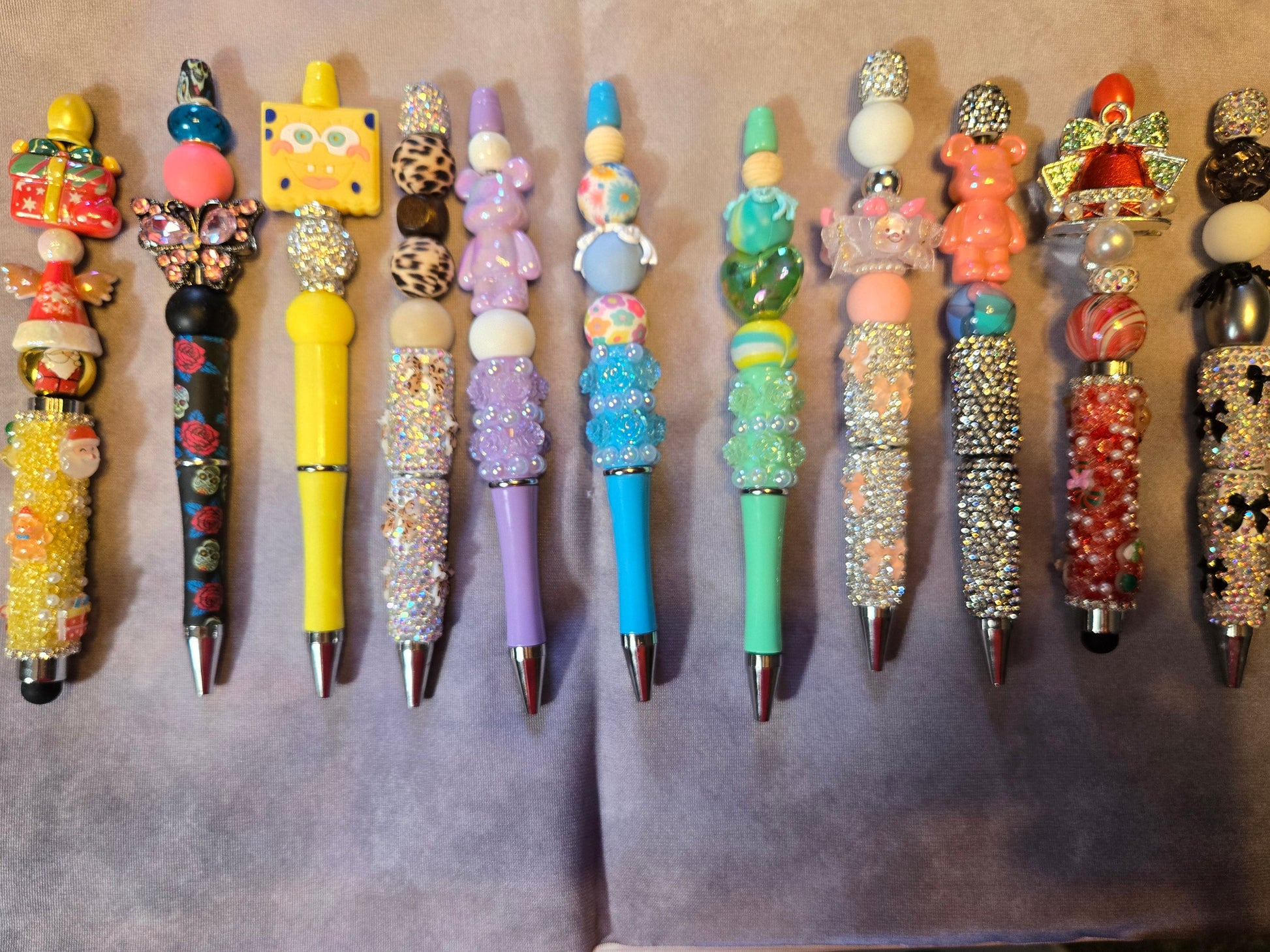 Decorative pens with colorful and intricate designs.